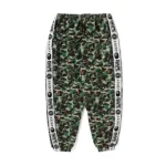 Meta Description (155–160 characters) Shop the Green BAPE x Saint Mx Camo Track Pants, featuring bold camo design, premium comfort, and modern streetwear style for a standout look. Short Description The Green BAPE x Saint Mx Camo Track Pants combine iconic camo aesthetics with modern streetwear comfort. Designed with a bold green pattern, premium fabric, and a relaxed fit, these track pants are perfect for casual outfits and urban fashion. Long Description The Green BAPE x Saint Mx Camo Track Pants are a statement piece designed for streetwear enthusiasts who value bold style, comfort, and quality craftsmanship. Featuring a distinctive green camouflage pattern, these track pants bring a fresh and stylish edge to any casual wardrobe. Crafted from high-quality materials, the pants offer a lightweight feel, durability, and all-day comfort. The relaxed fit allows easy movement while maintaining a modern streetwear silhouette. Their eye-catching camo design pairs effortlessly with hoodies, jackets, sneakers, and other urban-inspired pieces, making them a versatile addition to your collection. Designed with functionality in mind, the BAPE x Saint Mx Camo Track Pants include a comfortable waistband, practical pockets, and a durable construction built for everyday wear. Whether you're heading out, traveling, relaxing, or creating a complete streetwear outfit, these track pants deliver the perfect balance of style and performance. Key Features Premium-quality fabric for comfort and durability Bold green camouflage design Inspired by modern streetwear aesthetics Relaxed fit for everyday comfort Lightweight and breathable construction Functional pockets for daily essentials Adjustable waistband for a secure fit Durable stitching for long-lasting wear Perfect for casual outfits, travel, and streetwear styling Upgrade your streetwear collection with the Green BAPE x Saint Mx Camo Track Pants — a perfect blend of bold design, premium comfort, and modern urban fashion.